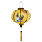 Glowing round shaped lantern with yellow tassel.