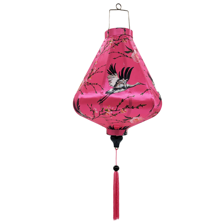 Teardrop shaped lantern with polyester silk fabric featuring large heron birds flying amongst pink flowers on a bright pink background and pink tassel.
