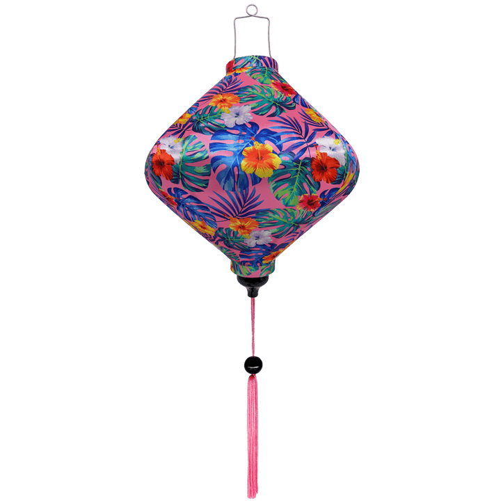 Lozenge shaped Vietnamese lantern with pink tassel and vibrant hibiscus flowers in on bright pink background. 