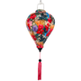 Hibiscus flowers lantern with colourful floral pattern on an olive green background.