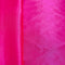 Close up of hot pink polyester silk fabric.