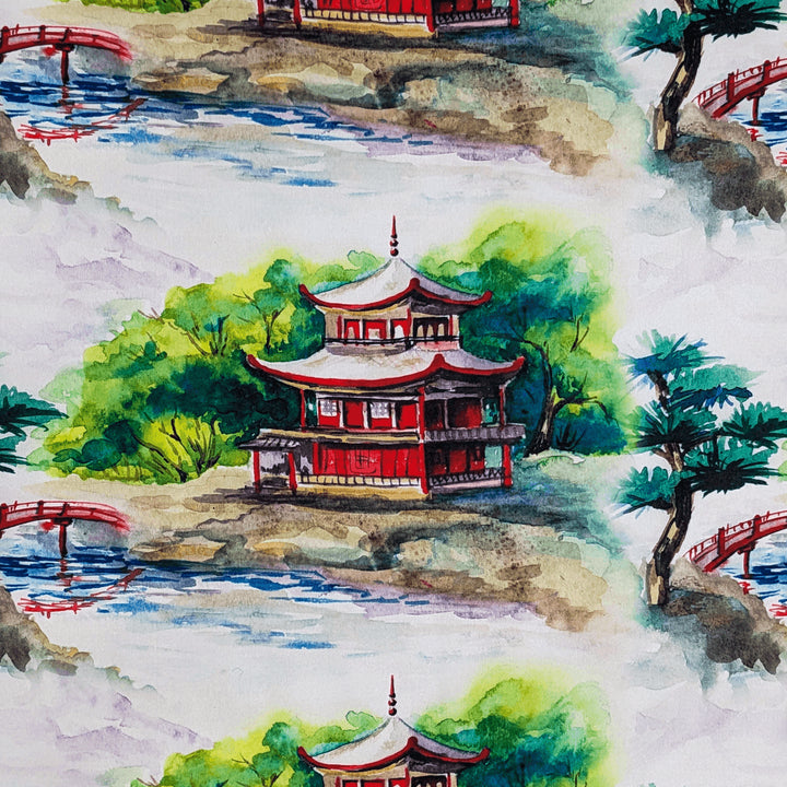 Polyester silk fabric used to create lanterns featuring a print of a temples surrounded by a tranquil rivers and picturesque bridge on white background.