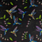Polyester silk fabric print featuring colourful cross stitched hummingbirds in flight amongst blue bell flowers and bright green leaves on black background.