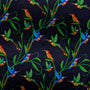 Polyester silk fabric with a prink of blue and orange hummingbirds sitting and flying amongst green plants on dark blue background used to create the Hoi An Lantern.