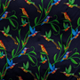 Polyester silk fabric with a prink of blue and orange hummingbirds sitting and flying amongst green plants on dark blue background used to create the Hoi An Lantern.