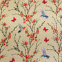 Polyester silk fabric featuring a print of hummingbirds in flight with red and pink flowers against cream.