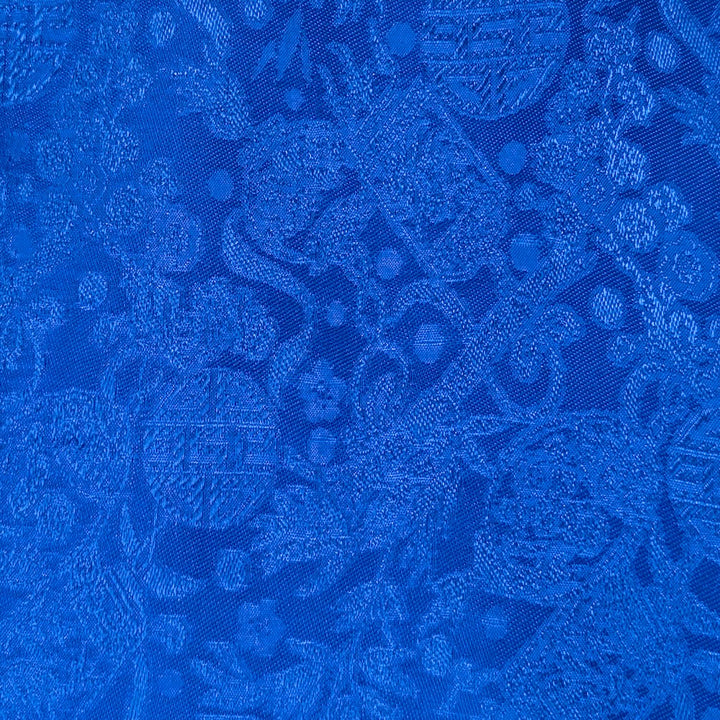 Dark blue Jacquard silk fabric with intricate pattern and sheen used to create Vietnamese silk lanterns