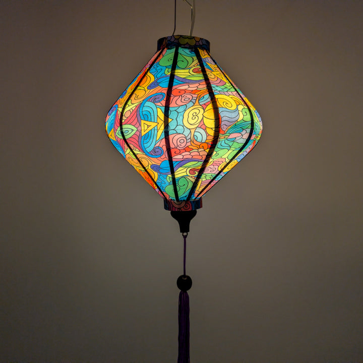 Glowing Lozenge shaped lantern with colourful geometric patterns