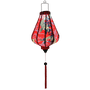 Glowing Teardrop shaped lantern with a print of large yellow koi fish swimming amidst swirls of white and thick black calligraphy.