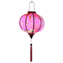 Glowing Round Hoi An Lantern creating a beautiful soft pink hue.