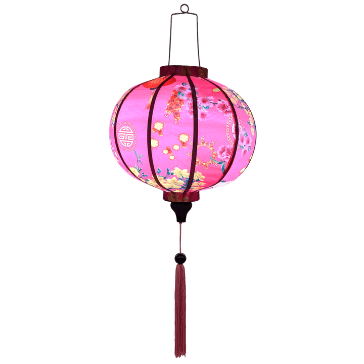 Glowing Round shaped Vietnamese lantern with pink tassels featuring a design of cranes, lanterns, firecrackers, and blooms of pink and yellow on a brilliant pink background. 