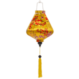 Teardrop shaped lantern with a print of pink and red blossoms against yellow background.