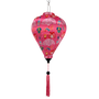Silk lantern with colourful patterns on a pink background