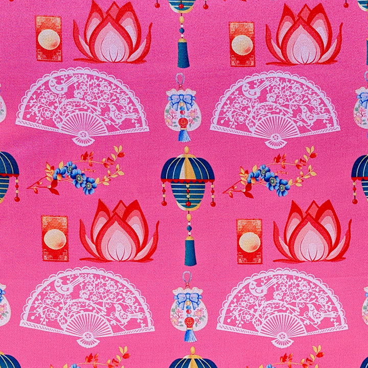Polyester silk fabric with a print of delicate white fans, teal blue and lanterns, with red and pink lotus flowers on a pink background.