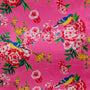 Polyester silk fabric with blue birds surrounded by pink and yellow flowers in bloom on gorgeous bright pink background used to create Hoi An Lanterns.