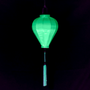 A balloon shaped mint green neon uv lantern with neon tassel.