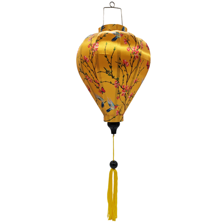 Balloon shaped Vietnamese Lantern with yellow tassel featuring a print of little hummingbirds mid-flight hunting nectar from orange flowers with red butterflies.