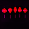 A row of hot pink lanterns glowing under UV light.