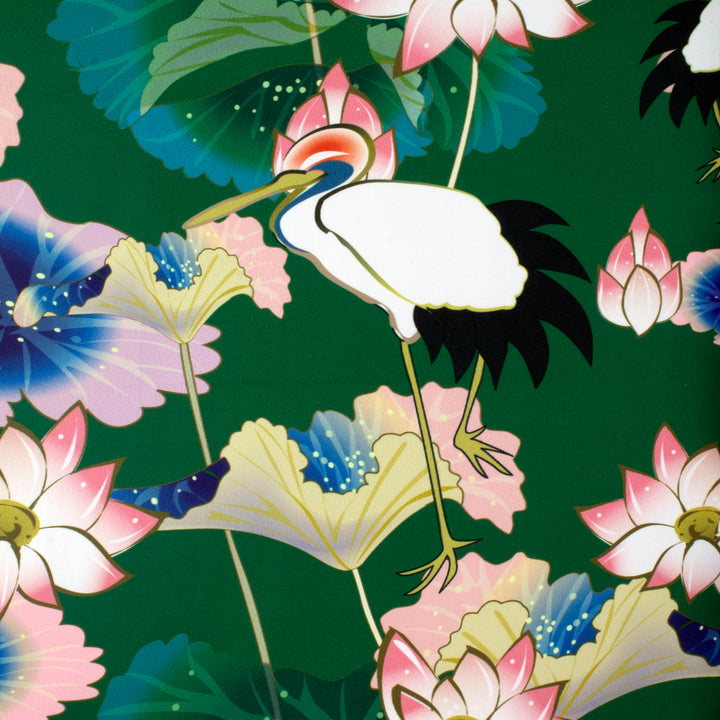 Polyester silk fabric with a print of Asian open-bill birds surrounded by beautiful pink lotus flowers on rich dark green background.