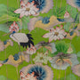 Decorative fabric with stork and lotus flowers on a green background