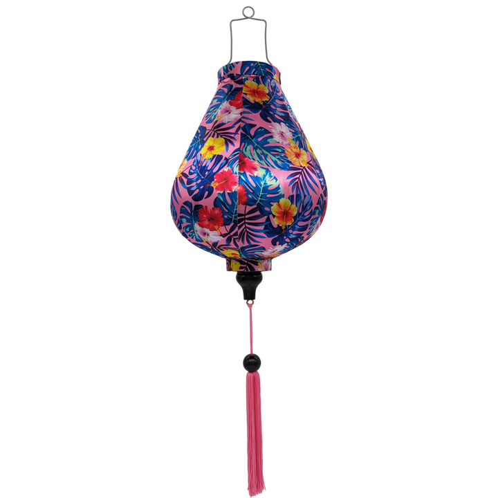 Garlic shaped Vietnamese lantern with pink tassel and vibrant hibiscus flowers in on bright pink background. 