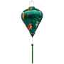 Balloon shaped lantern with green tassel an print of parrots in vivid colours surrounded by palm leaves on a green background. 