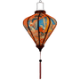 Glowing lantern with large phoenix bird rising with blue, gold, and pink wings.