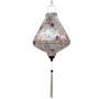 Teardrop shaped hanging lantern with floral and bird pattern on a light pink background and white tassel