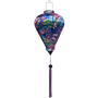 Balloon shaped Vietnamese lantern with  print of pink flamingos, hibiscus, and frangipani flowers on a blue background. 