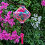 Lozenge shape Vietnamese silk lantern with flamingo print on pink.