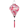 Decorative hanging lantern with pink fish pattern on a white background
