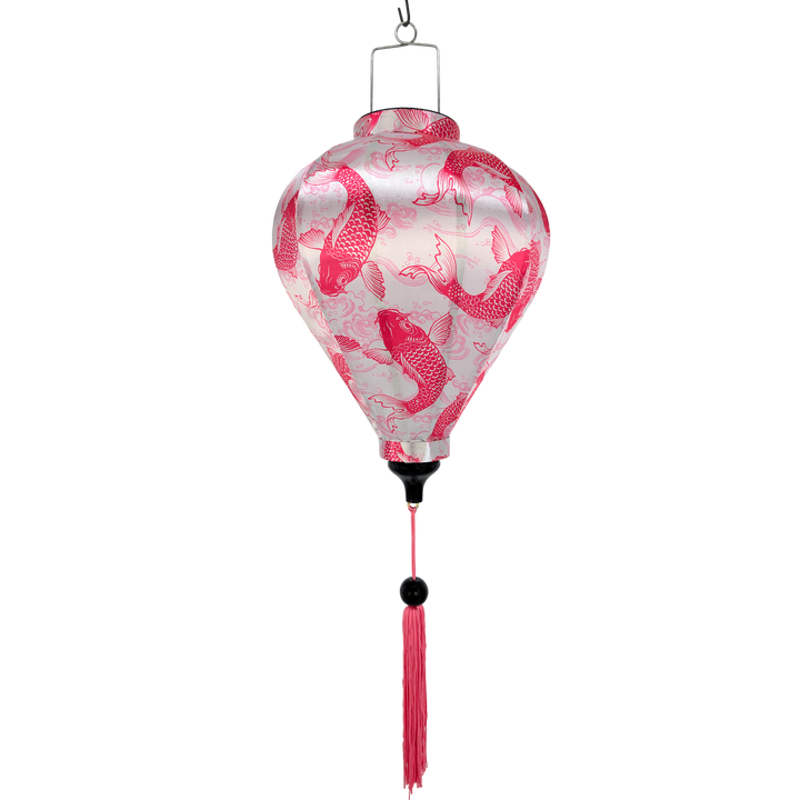 Decorative hanging lantern with pink fish pattern on a white background