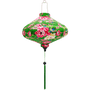 UFO shaped lantern with pink and yellow roses on green background.