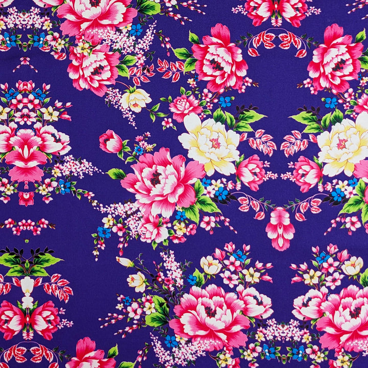 Traditional Vietnamese lantern polyester silk fabric featuring pink rose motifs on deep purple silk, used for handcrafting lanterns in Hoi An.
