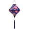 Floral-patterned purple silk lantern, created by Hoi An’s artisanal craftsmanship for cozy lighting.

