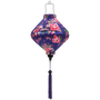 Floral-patterned purple silk lantern, created by Hoi An’s artisanal craftsmanship for cozy lighting.
