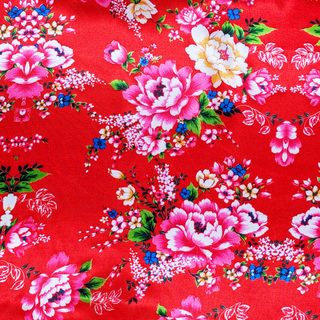 Floral pattern with pink and yellow flowers on a red background
