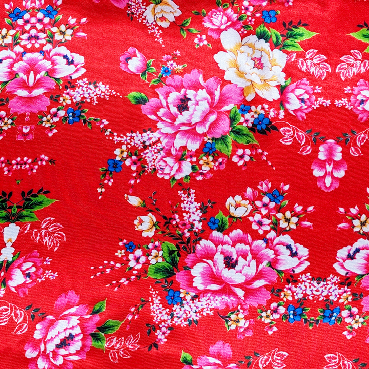 Floral pattern with pink and yellow flowers on a red background