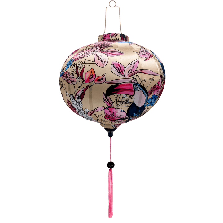 Round Vietamese silk lantern with a pink tassel and print of pink toucans on cream backdrop.