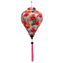 A balloon shaped 30 cm lantern with a print of hot pink flamingos and flowers on a light pink background.