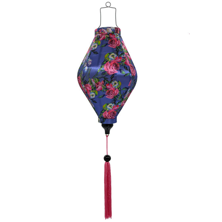 Tube shaped Vietnamese lantern with pink tassel and with print of pink roses and purple flowers against gorgeous purple background perfect for home decor!