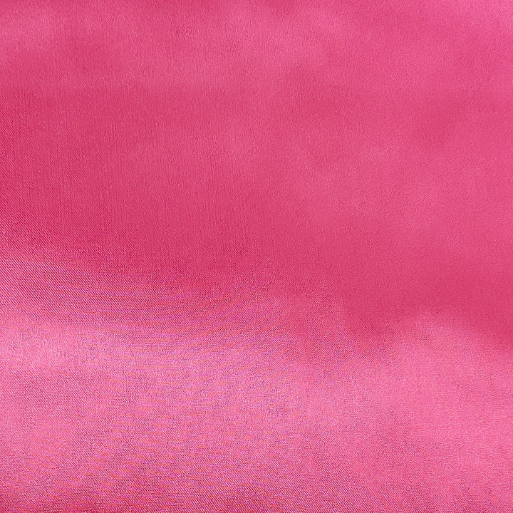 Pink polyester silk fabric used to create Vietnamese silk lanterns in Hoi An.