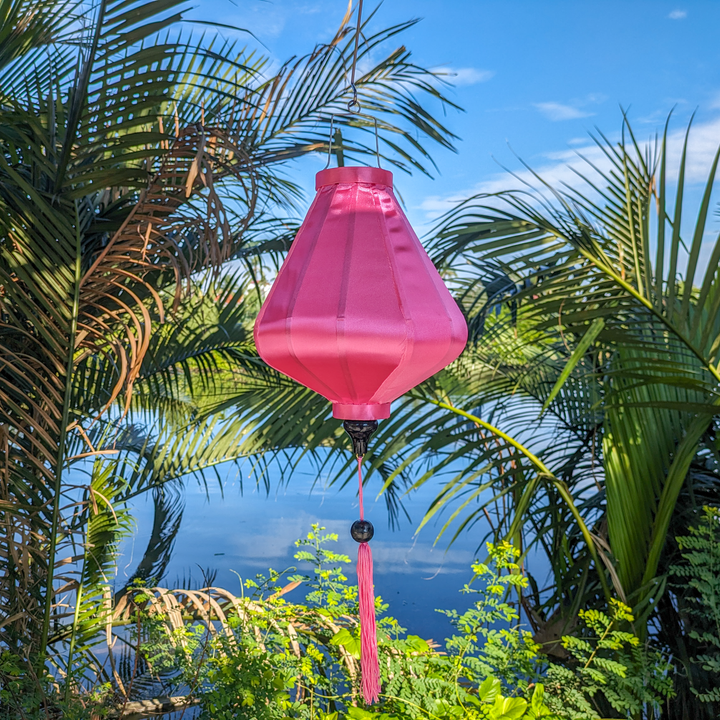 Traditional Vietnamese pink lantern with a smooth silk finish, ideal for indoor and outdoor decoration.