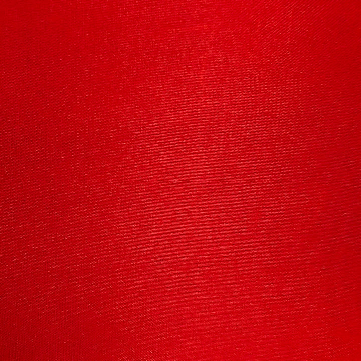 Plain red polyester silk fabric used to create Vietnamese silk lanterns in Hoi An.