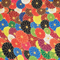 A vibrant and colourful fabric pattern featuring an intricate arrangement of multicolored flowers outlined in gold. The floral design includes shades of red, blue, yellow, green, black, pink and white, creating a striking and lively composition.