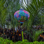 Colorful round Hoi An silk lantern with intricate rainbow paisley patterns, handcrafted in Hoi An.