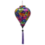 Balloon shaped lantern with purple tassel made with polyester silk fabric with green, pink, purple, orange, yellow leaves set against a rich purple background. 