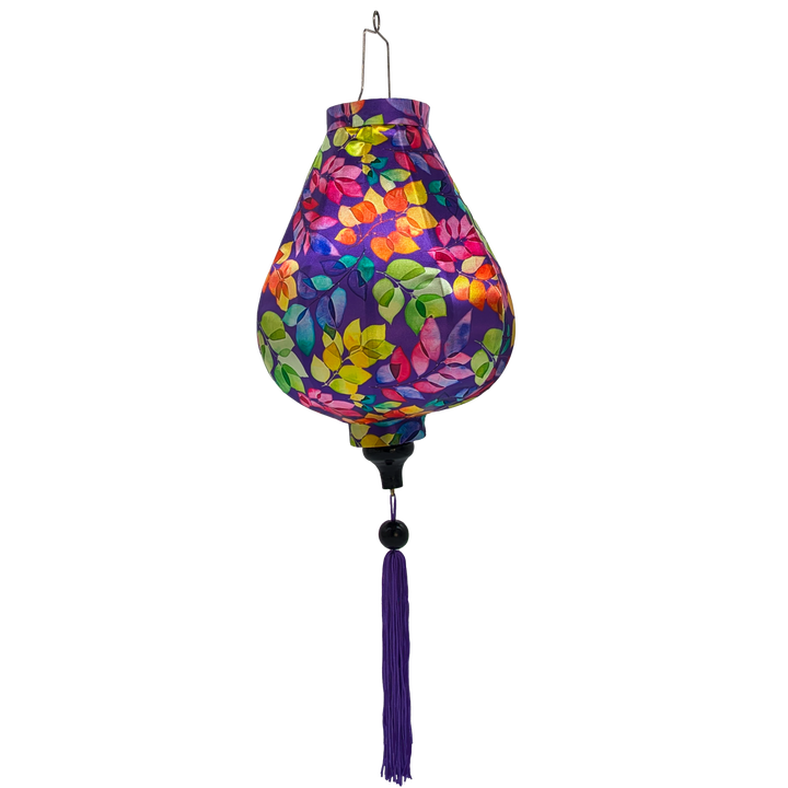 Garlic shaped lantern with purple tassel made with polyester silk fabric with green, pink, purple, orange, yellow leaves set against a rich purple background. 