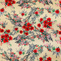 Polyester silk fabric with delicate floral print of red blossoms and elegant black branches on a cream background. 