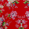 Polyester silk fabric for traditional Vietnamese lanterns featuring pink rose motifs on vibrant red silk, handcrafted in Hoi An.